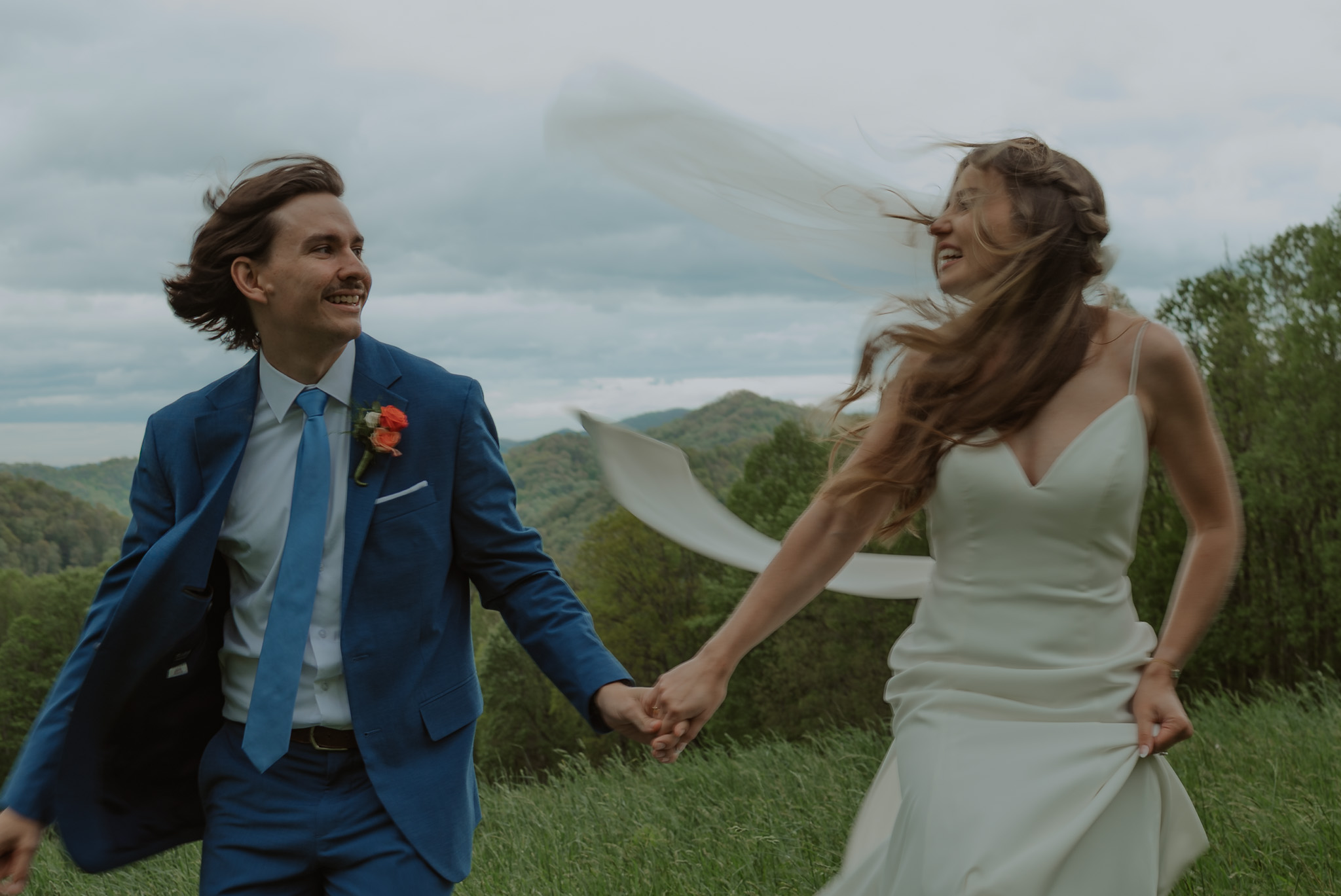 running wedding couple in the mountains of north carolina