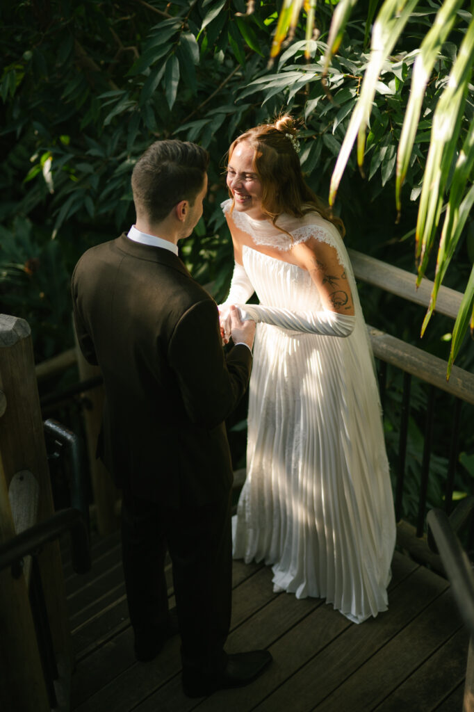 Bride and groom seeing each other on their wedding day full of excitement
