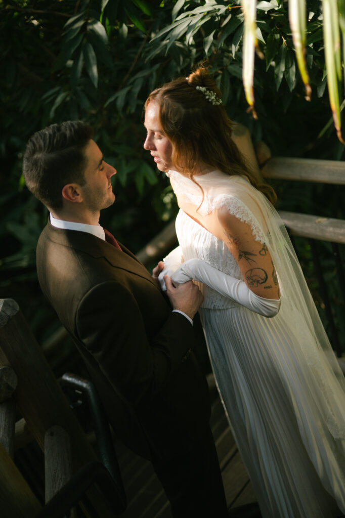 Bride and groom holding hands and praying together before ceremony