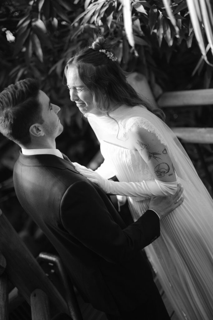 Bride and groom sharing an intimate moment together during first look, lots of emotions