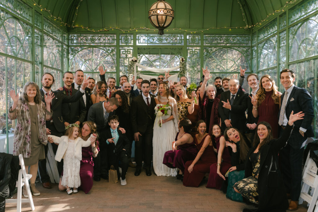 Group photo of all wedding guest with bride and groom