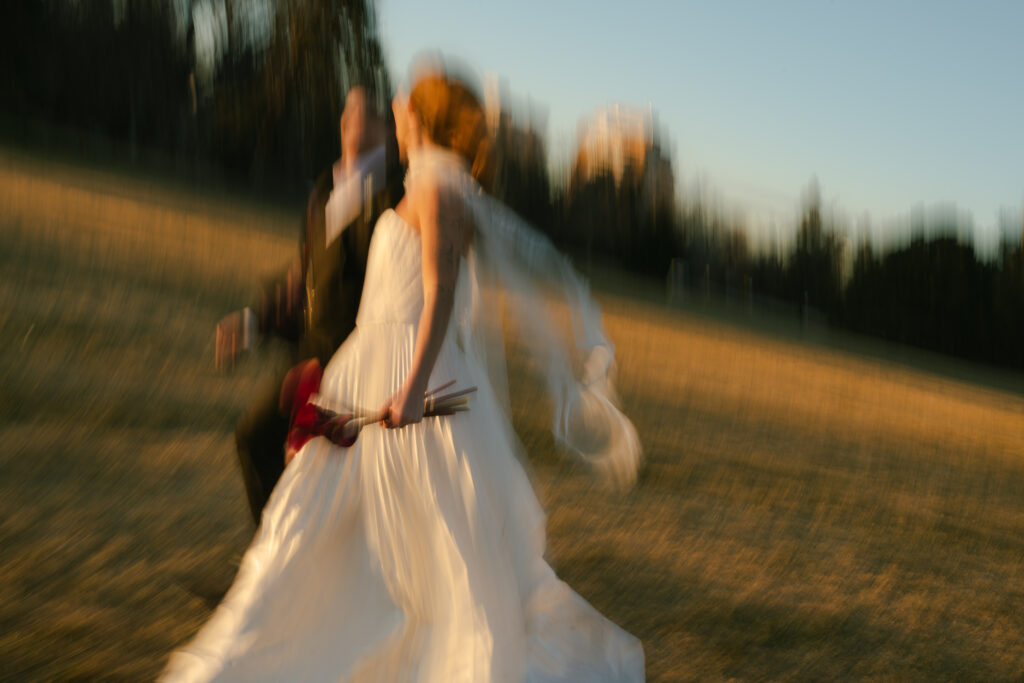 Bride and groom running together